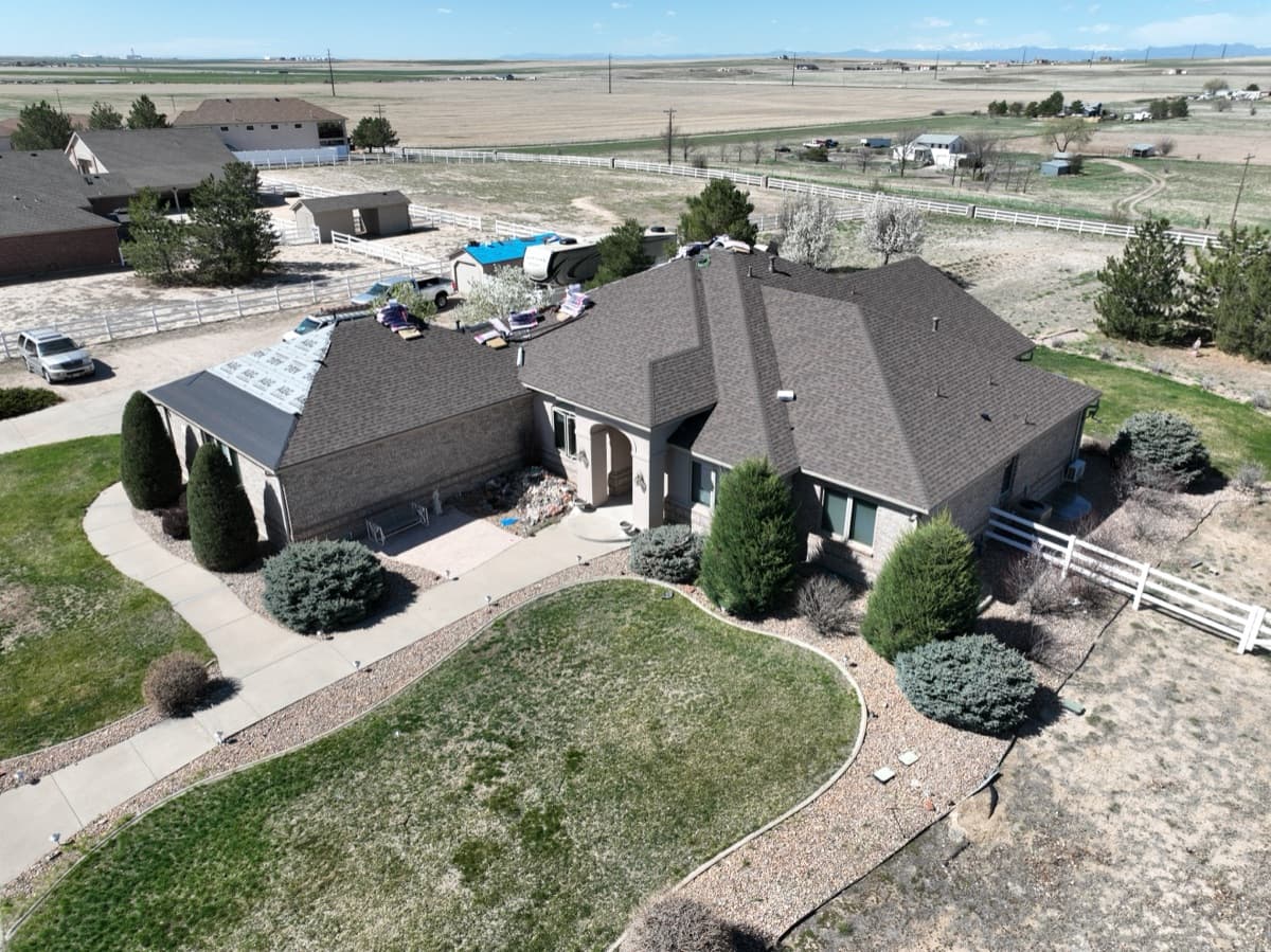 Drone aerial view of roof installation by Gates Enterprises in Colorado
