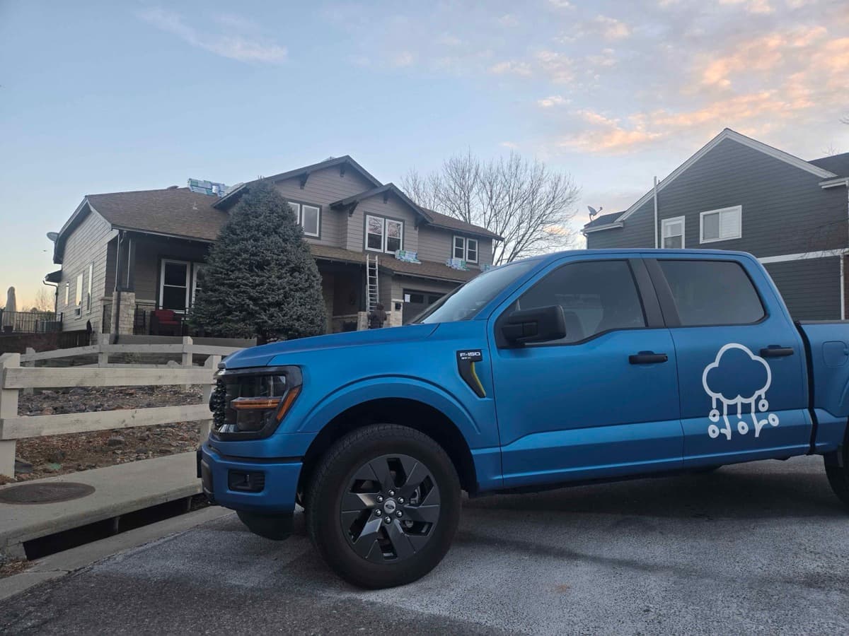 Gates Enterprises truck loaded with roofing materials