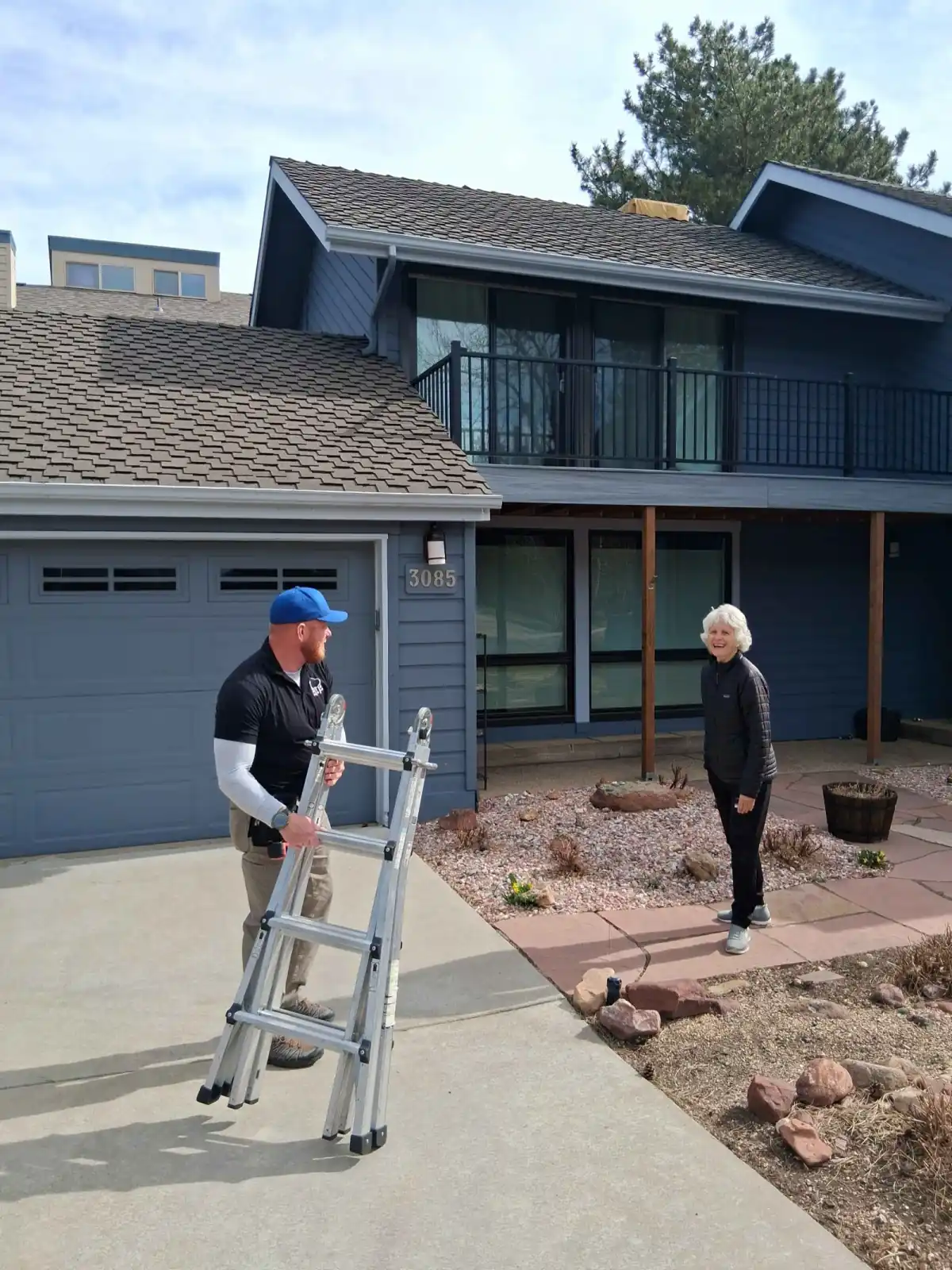 Happy customer after roof replacement by Gates Enterprises in Colorado